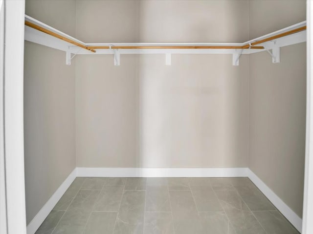 walk in closet featuring light tile patterned floors