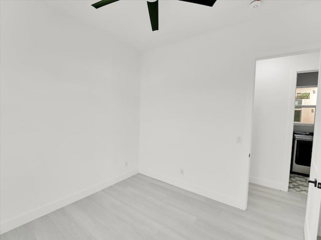 unfurnished room with ceiling fan and light hardwood / wood-style flooring