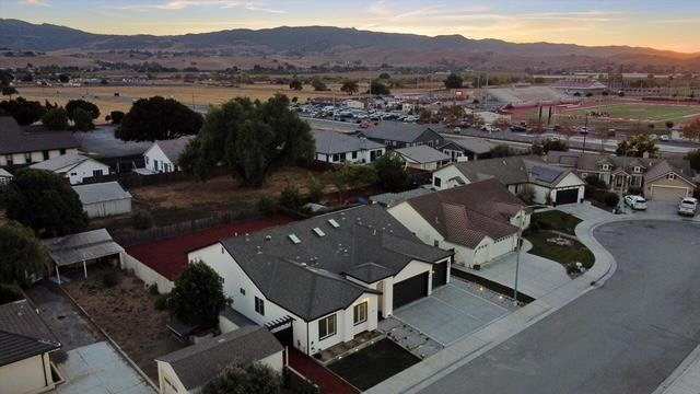 aerial view at dusk featuring a mountain view