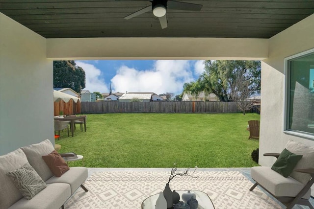 view of yard featuring ceiling fan, a patio area, and outdoor lounge area