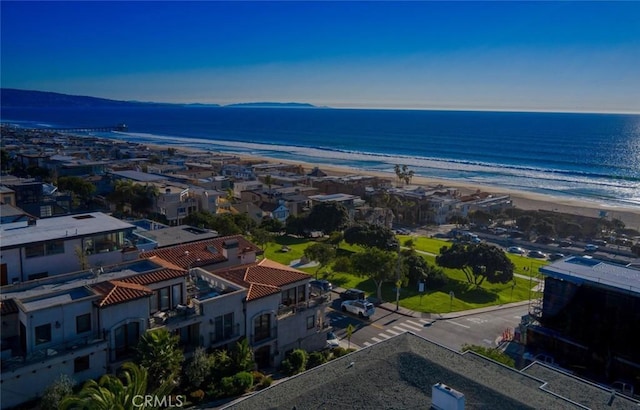 aerial view with a water view and a view of the beach