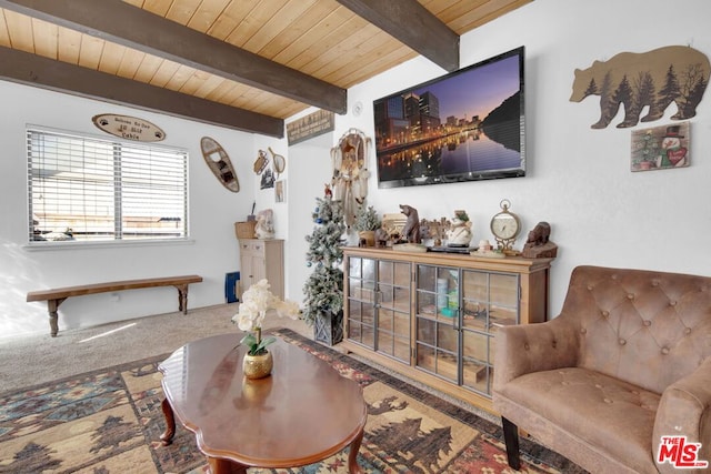 carpeted living room with beam ceiling and wooden ceiling