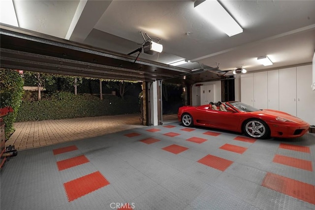 garage featuring a garage door opener