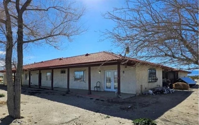 back of property featuring french doors