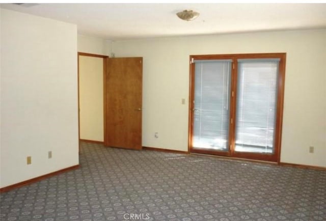 empty room featuring carpet flooring