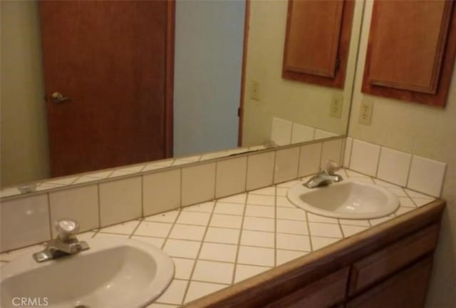 bathroom with vanity and backsplash