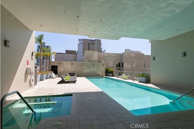 view of swimming pool featuring a patio