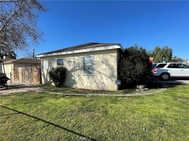 view of home's exterior with a lawn