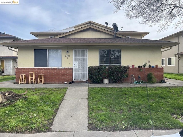 bungalow with a front yard