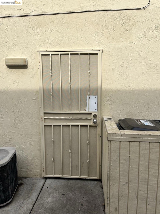 view of exterior entry featuring cooling unit