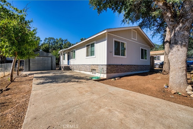 view of front of home with an outdoor structure and a garage