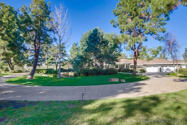 exterior space featuring a front yard and a garage