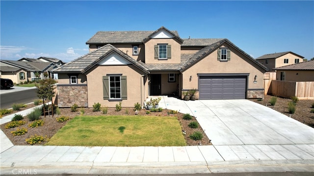 view of front of home featuring a front yard and a garage