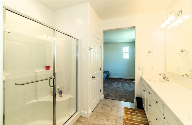 bathroom with vanity, tile patterned flooring, and an enclosed shower