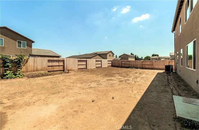 view of yard featuring central air condition unit