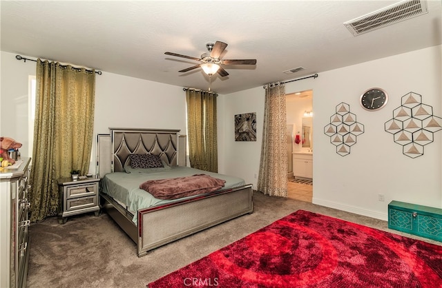 carpeted bedroom featuring connected bathroom and ceiling fan