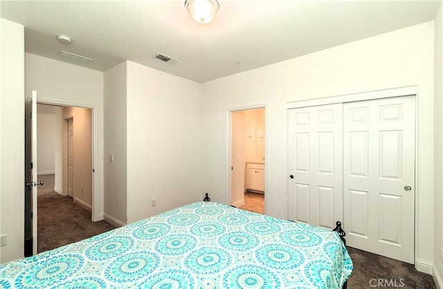 carpeted bedroom with a closet