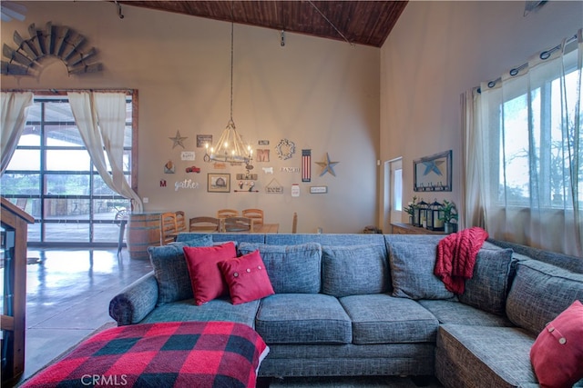 living room featuring a notable chandelier, high vaulted ceiling, and wooden ceiling