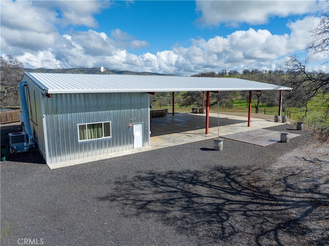 view of vehicle parking with a carport