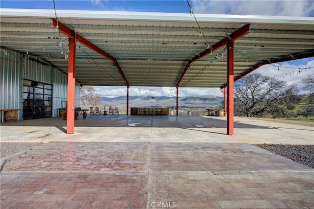 view of car parking with a mountain view