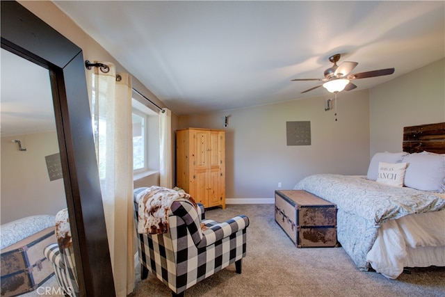 bedroom featuring ceiling fan, lofted ceiling, and light colored carpet