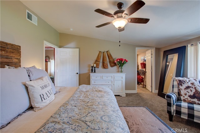 bedroom featuring a walk in closet, a closet, ceiling fan, lofted ceiling, and light colored carpet