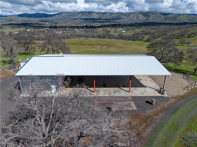 drone / aerial view featuring a mountain view