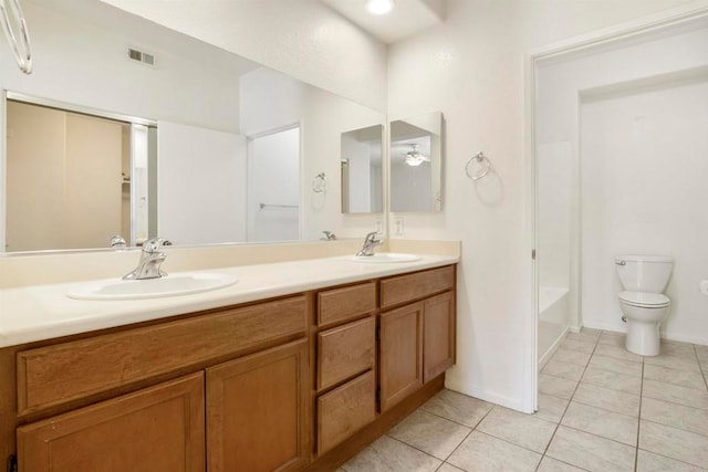 full bathroom with toilet, shower / washtub combination, vanity, and tile patterned floors