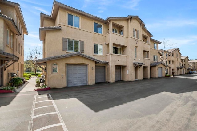 view of building exterior featuring a garage