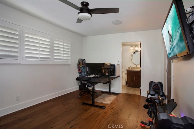 home office with wood-type flooring and ceiling fan