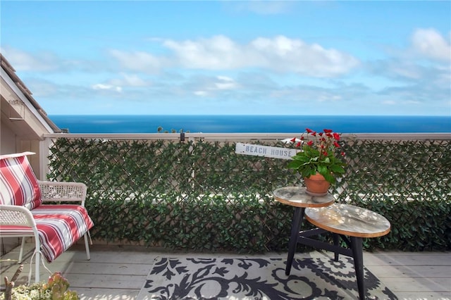 balcony featuring a water view