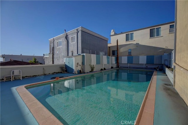 view of pool with fence and a fenced in pool