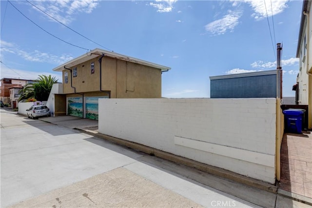 view of side of property with stucco siding