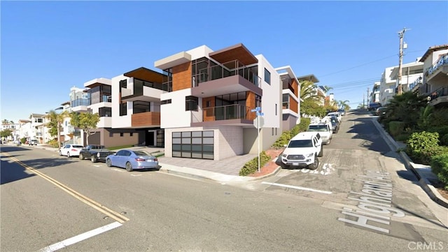 view of street featuring curbs, sidewalks, and a residential view