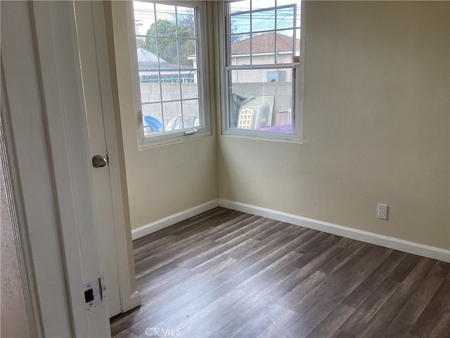 unfurnished room featuring hardwood / wood-style flooring