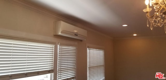 interior details with a wall unit AC and crown molding