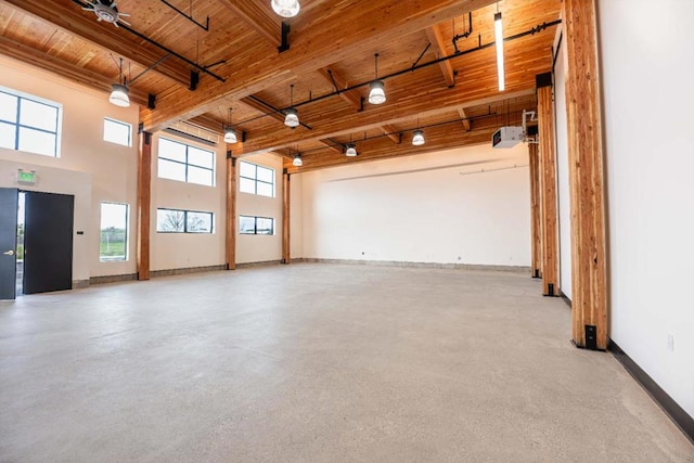 spare room featuring beam ceiling and wood ceiling