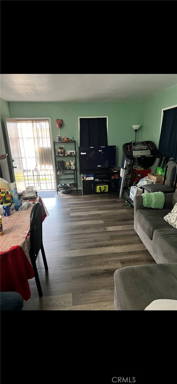 living room with dark hardwood / wood-style floors