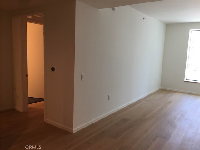 spare room with light wood-type flooring