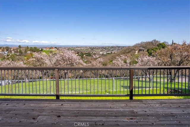 wooden terrace with a yard