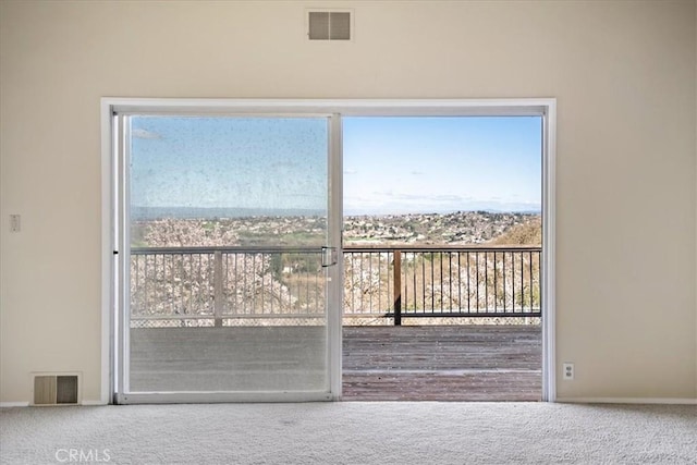 doorway featuring carpet