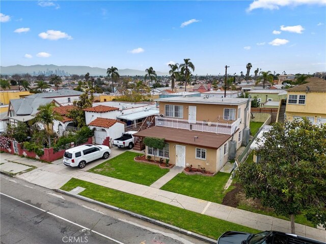 6820 S Van Ness Ave, Los Angeles, CA 90047 - aerial perspective of suburban area featuring a mountainous background
