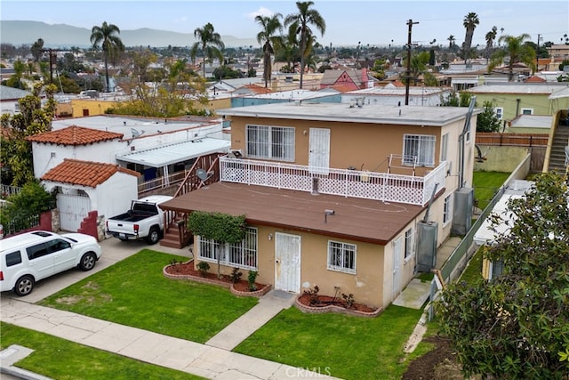 6820 S Van Ness Ave, Los Angeles, CA 90047 - view of front of property with stucco siding, driveway, a balcony, a garage, and a residential view