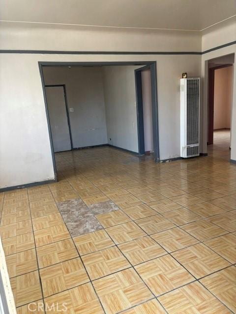 6820 S Van Ness Ave, Los Angeles, CA 90047 - unfurnished room with a heating unit