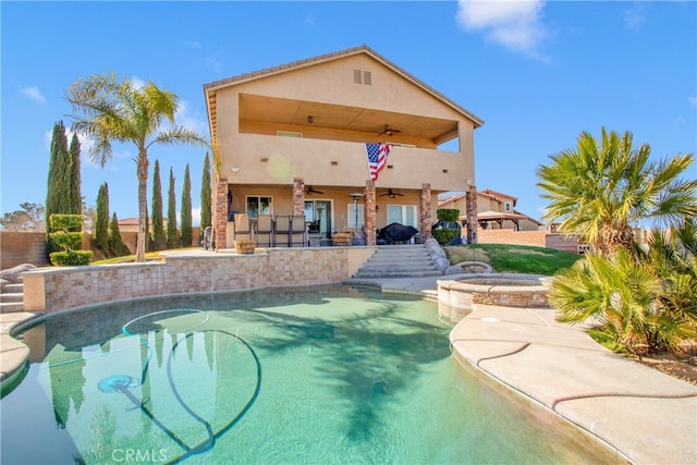 view of pool with ceiling fan, an in ground hot tub, and a patio area