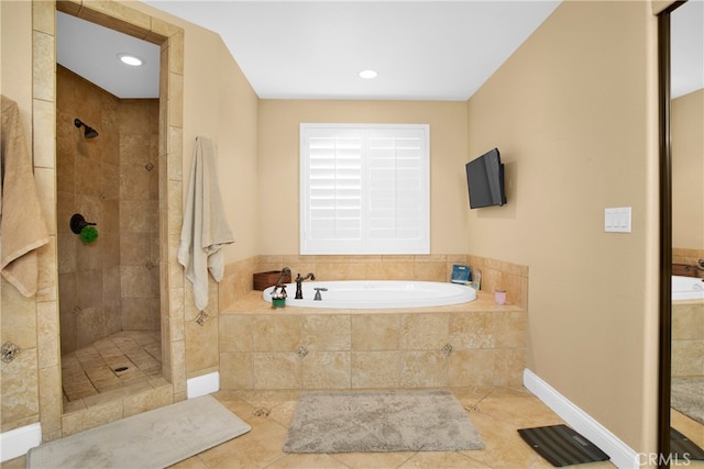 bathroom featuring shower with separate bathtub and tile patterned flooring