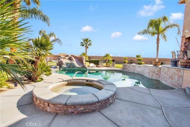 view of pool featuring an in ground hot tub and a patio area