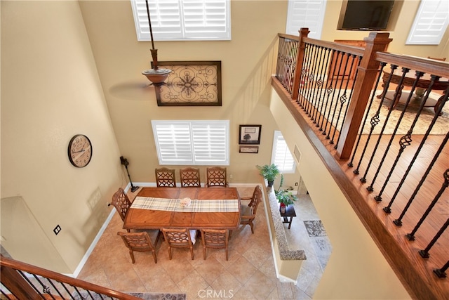 dining room with a high ceiling