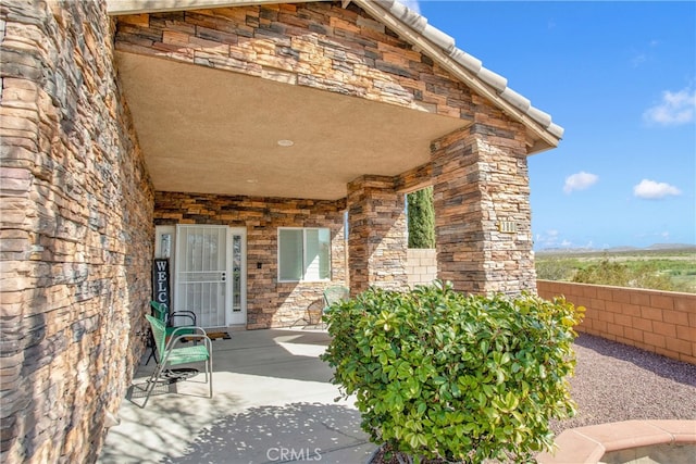 doorway to property with a patio