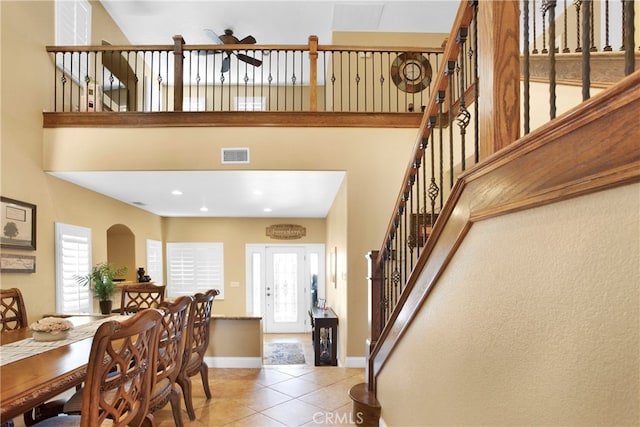 tiled dining area featuring ceiling fan